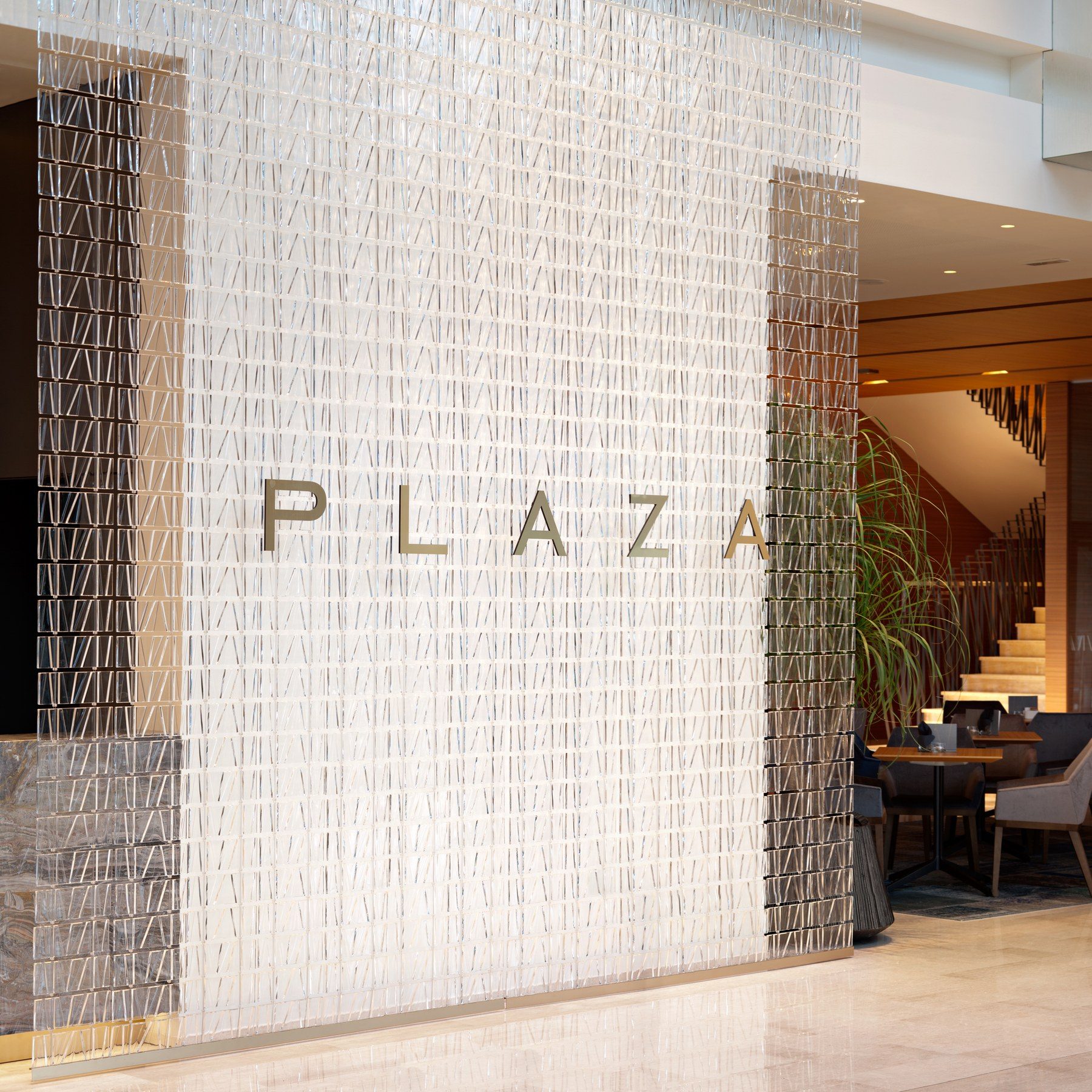 Tile glass light curtain in a hotel lobby · © Fabbian