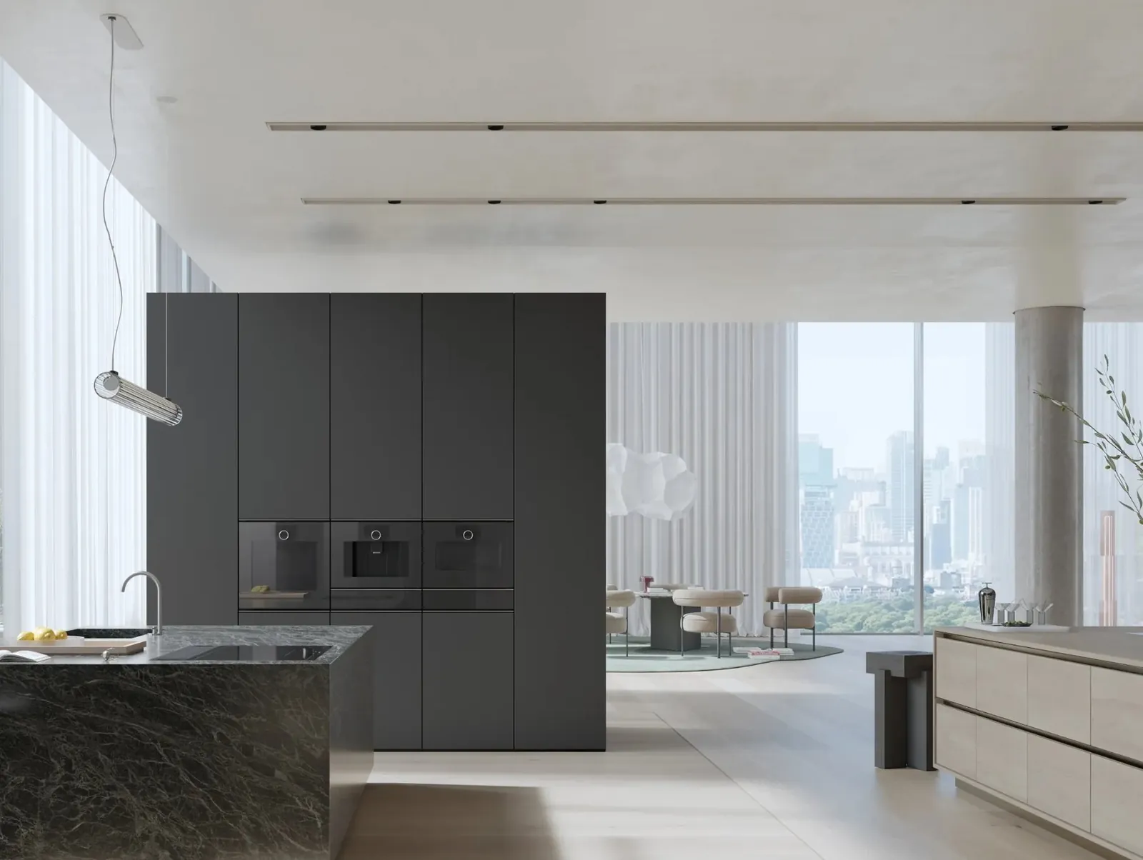 Backöfen und Insel aus dunklem Stein · © Gaggenau
