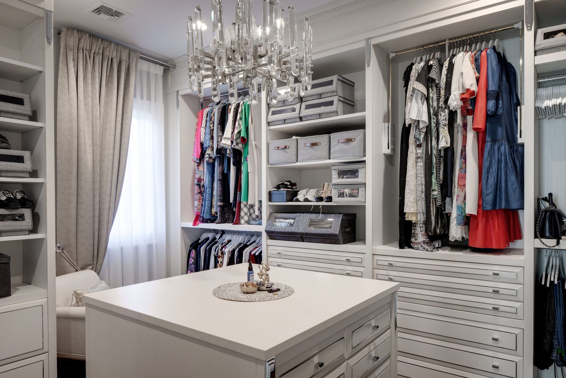 Walk-in wardrobe with central island · Project and image © Martini Interiors