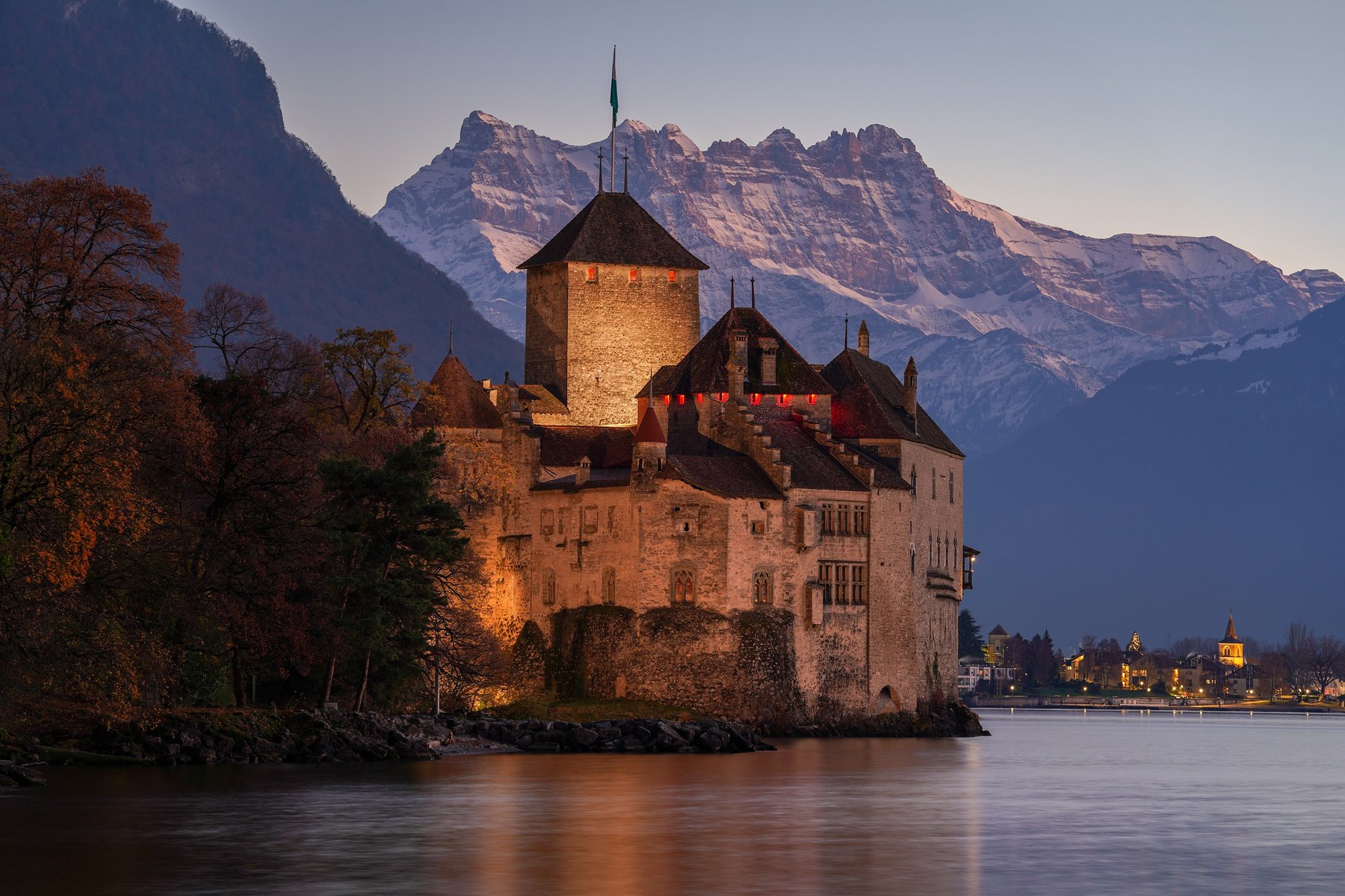 Chillon Castle at dusk on Lake Geneva, facing the Dents du Midi