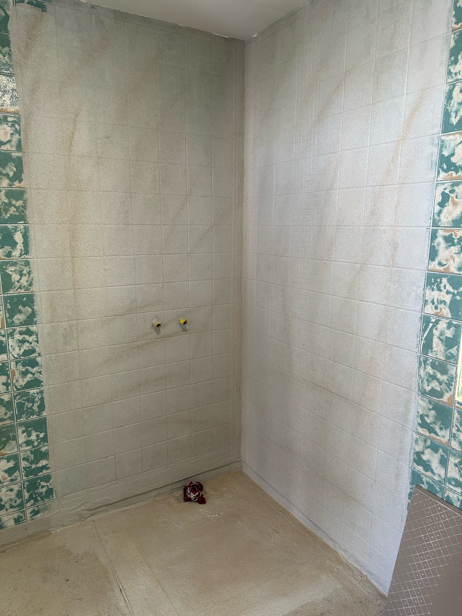 Tiled bathroom before the fixtures were fitted