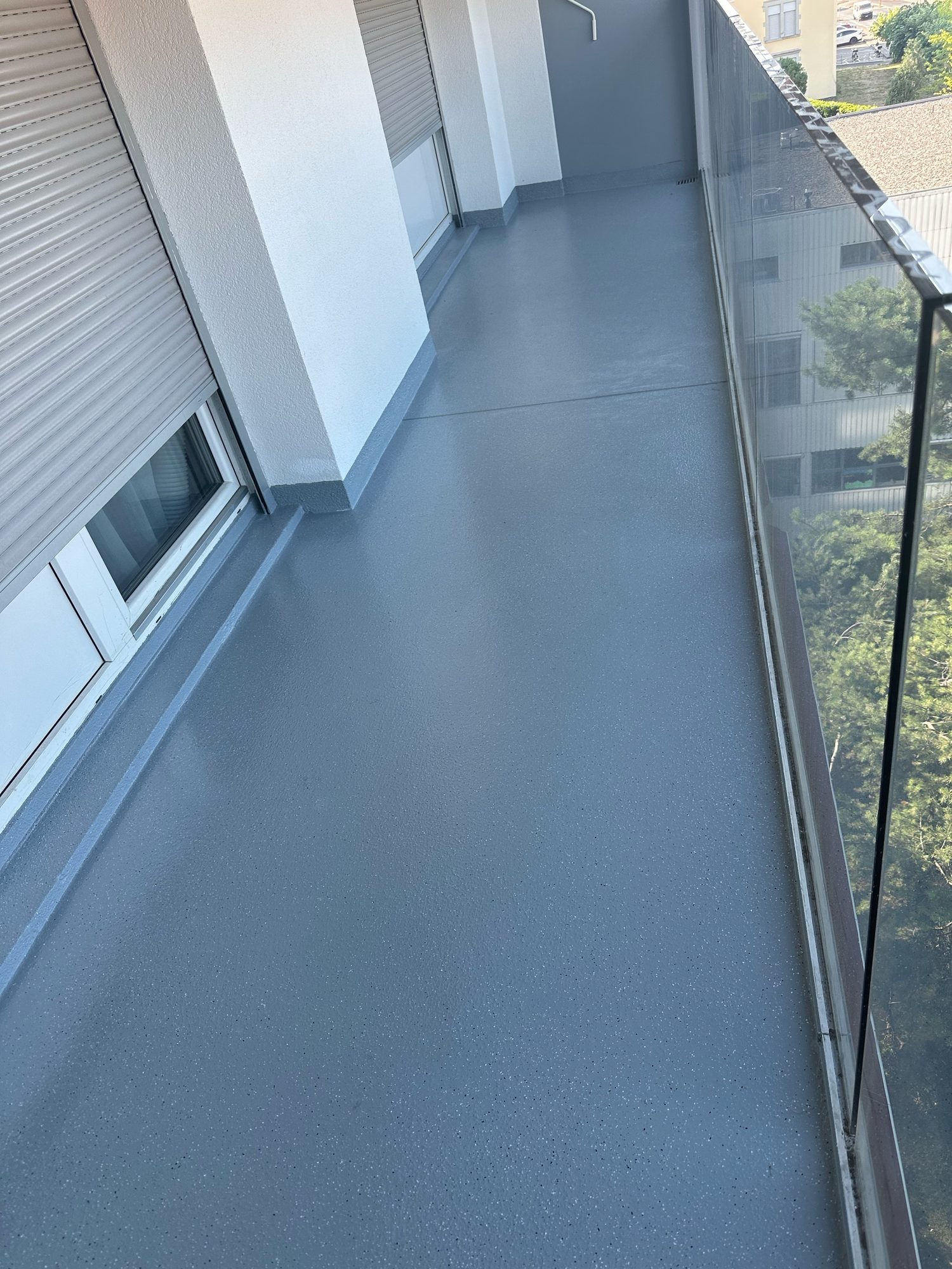 Resin walkway in front of the windows