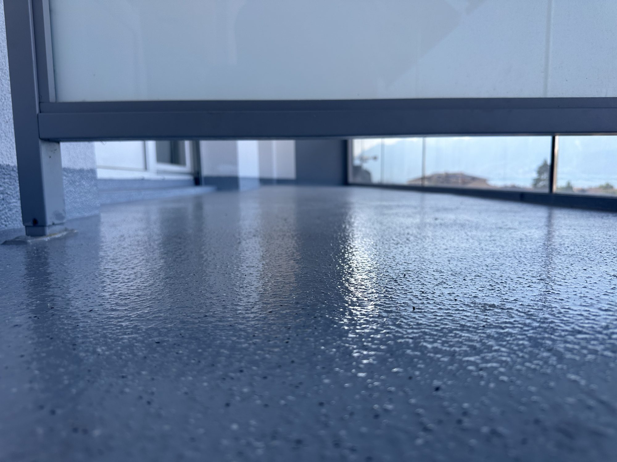 Glossy grey resin on a balcony
