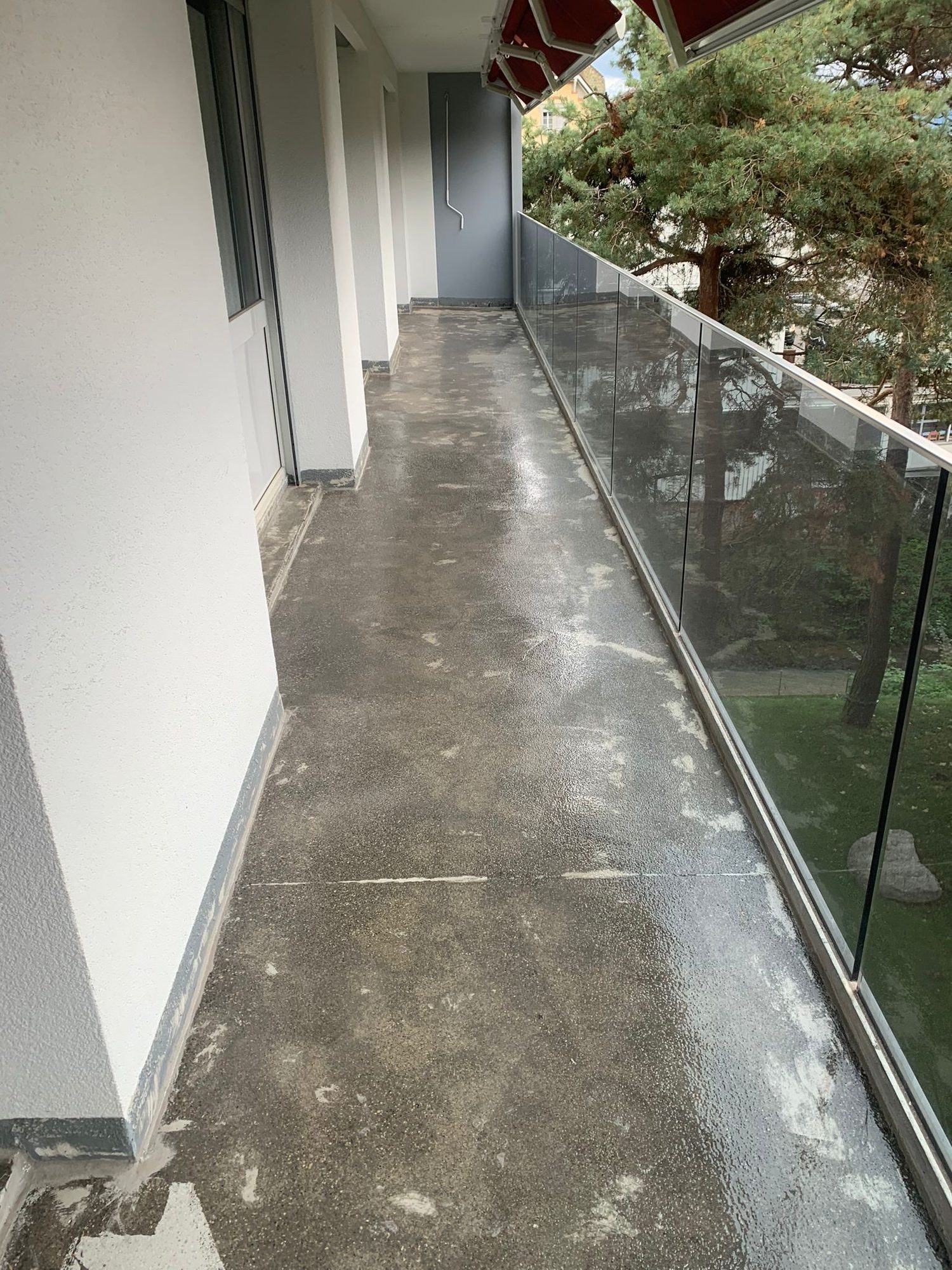 Walkway with a stained floor, before the work