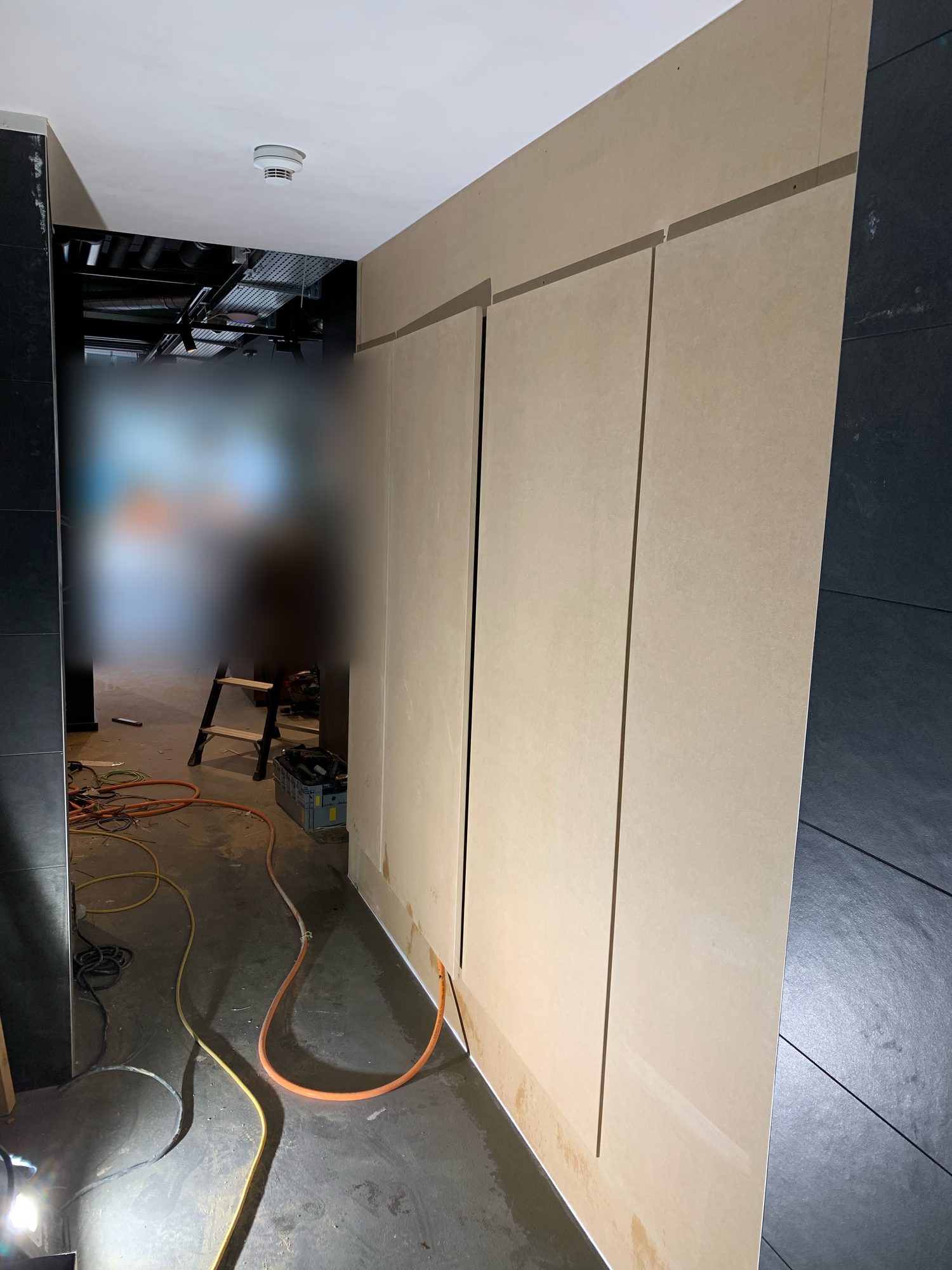 Fitting the wood panels on the walls