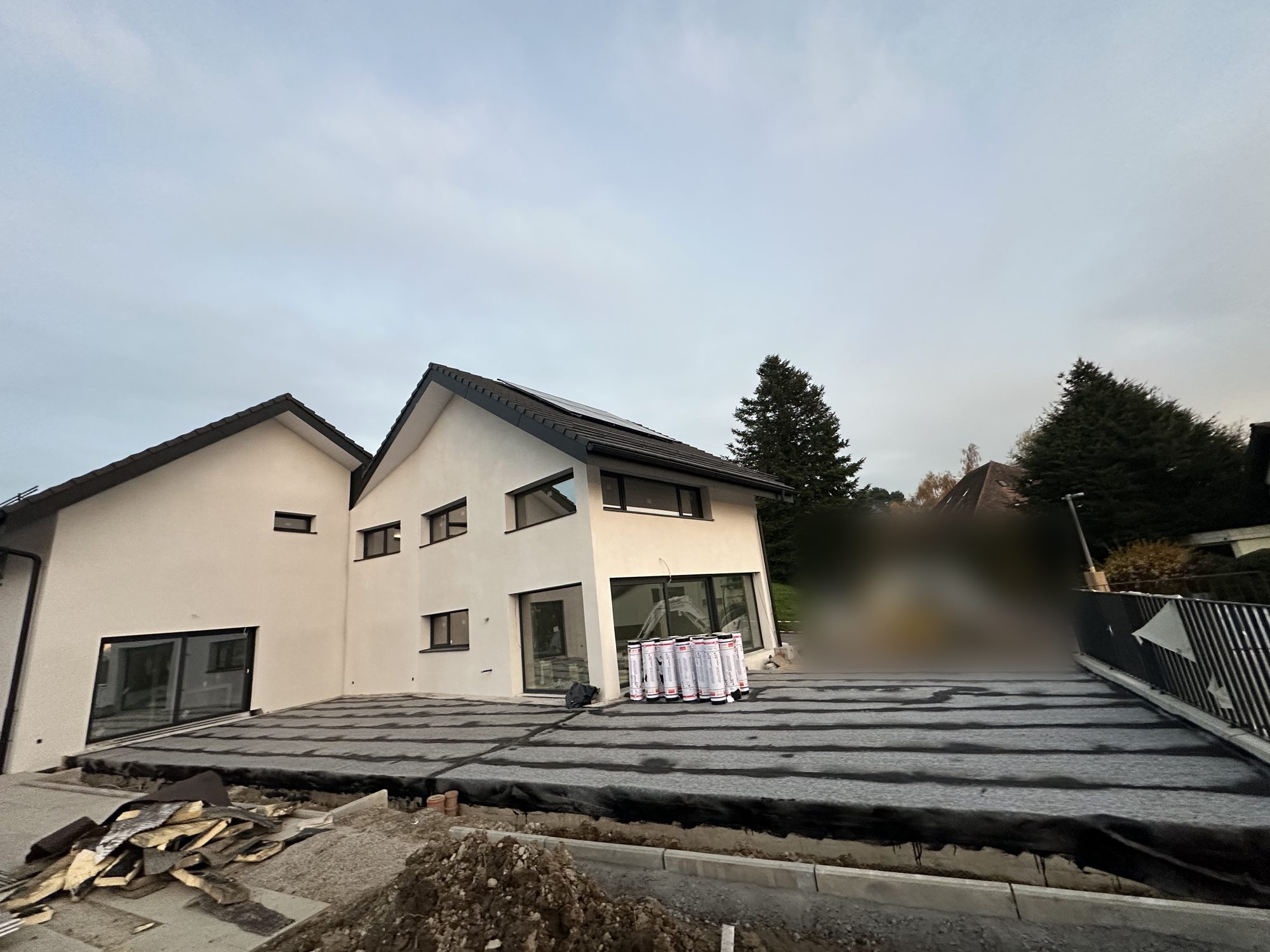 Torch-welded bitumen terrace in front of new houses
