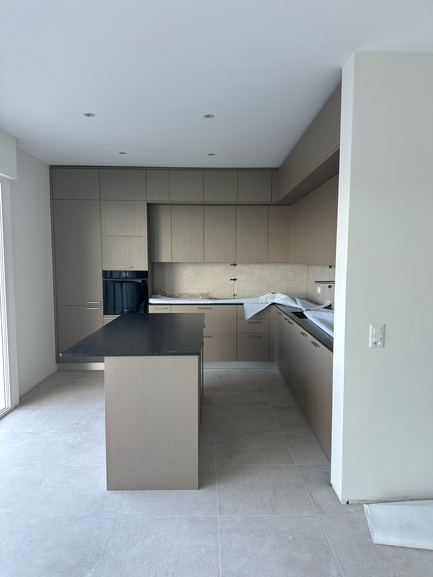 Built-in taupe tall units and kitchen island