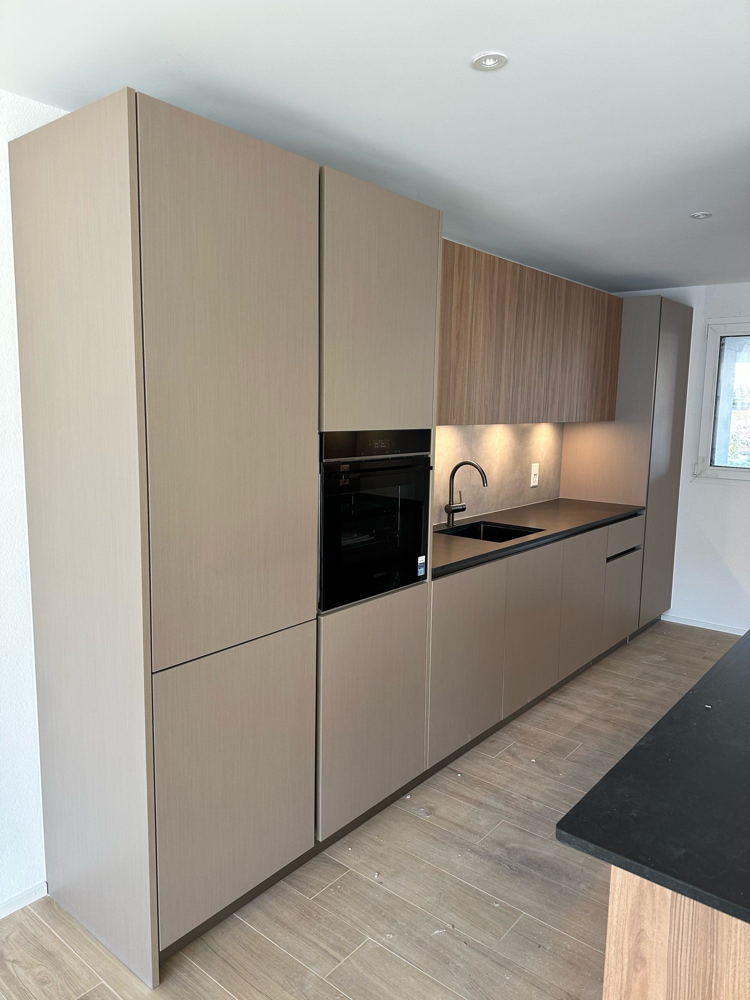 Detail of the island and taupe tall units