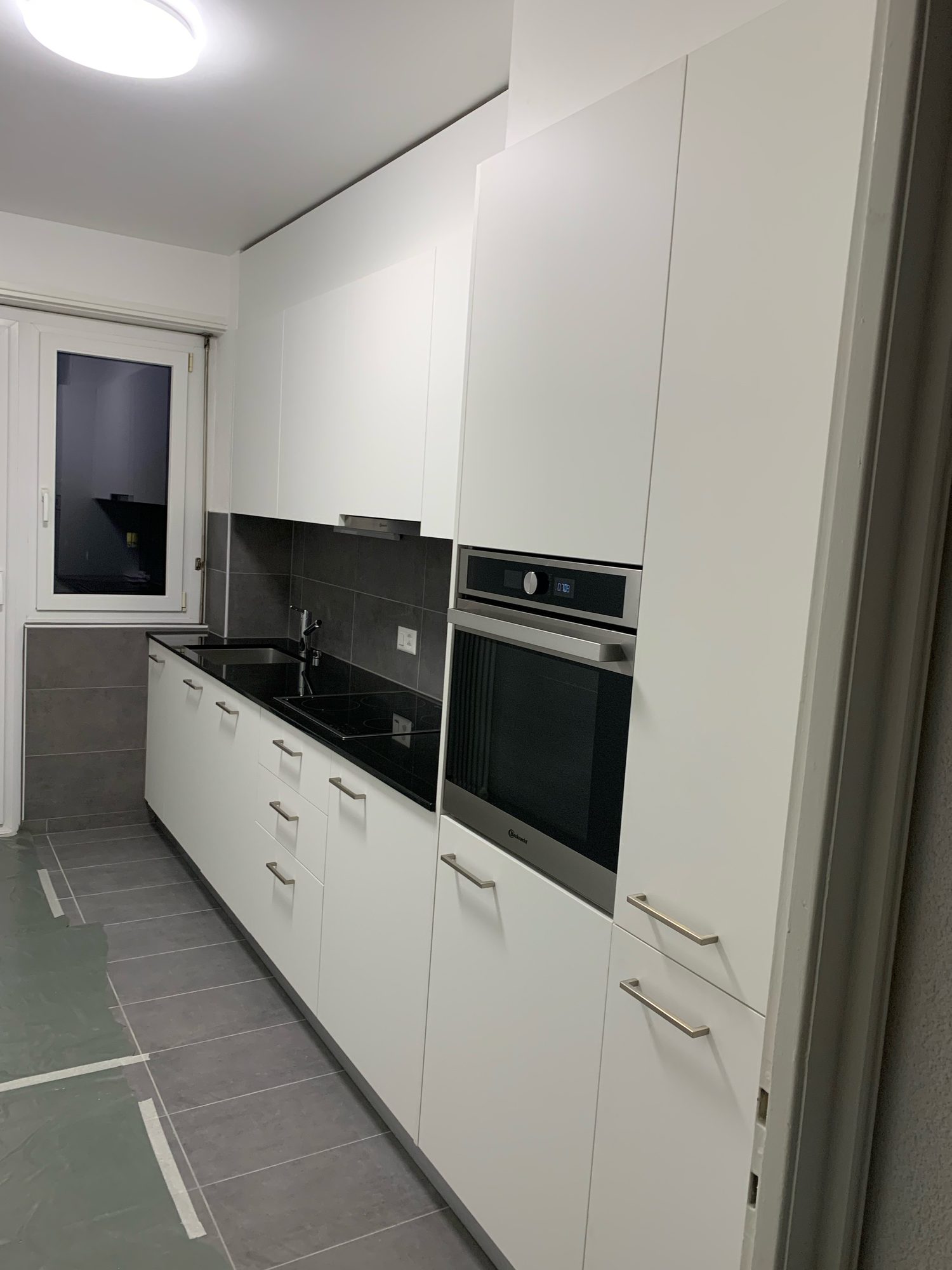Oven tower and white kitchen, another angle
