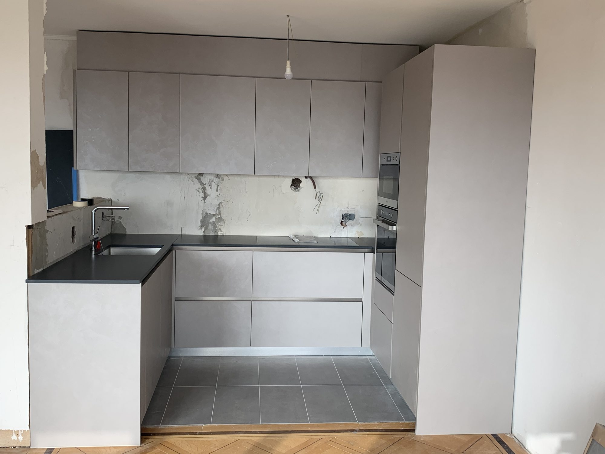 U-shaped kitchen being installed