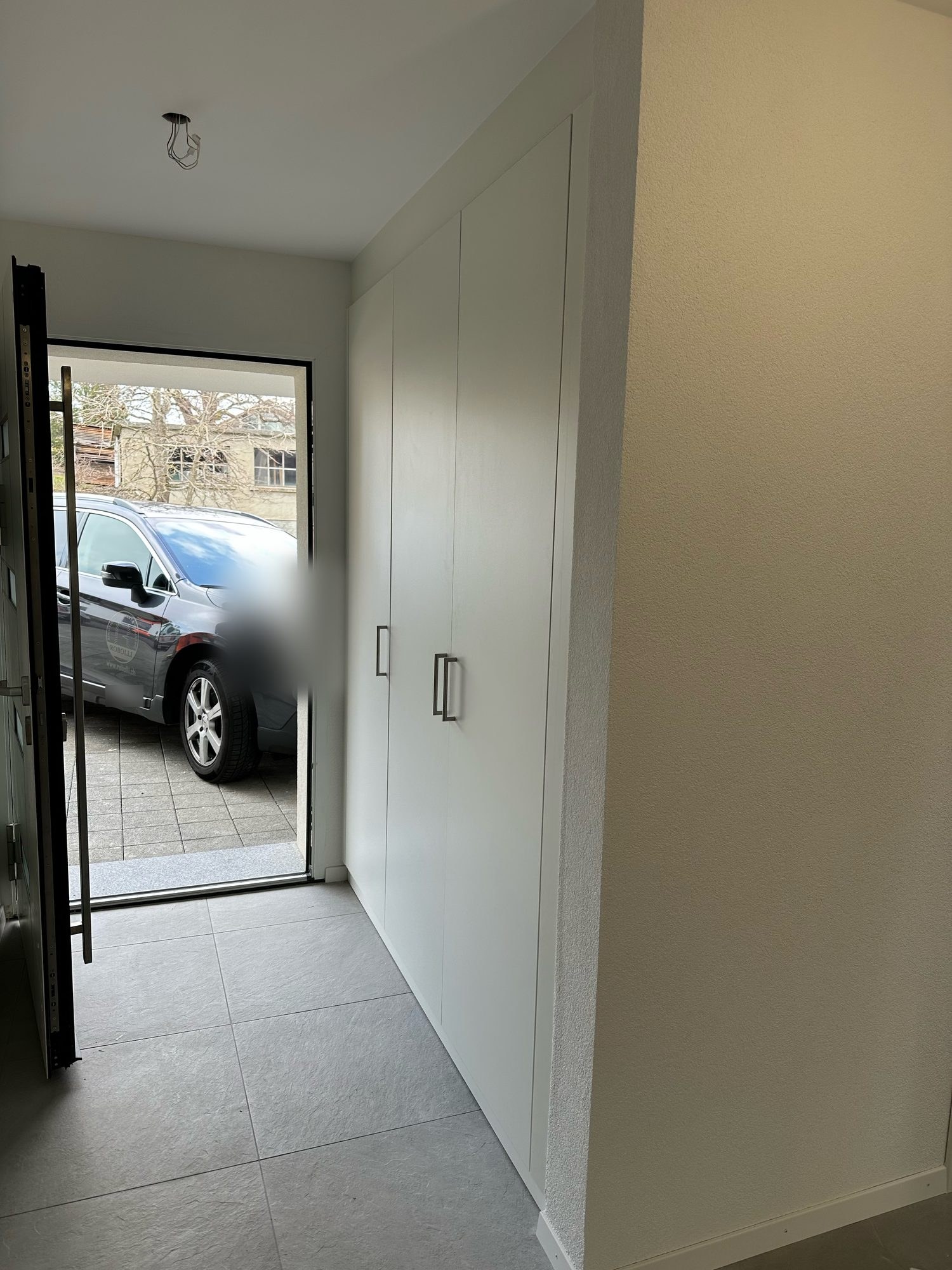 White fronts of the entrance cupboard