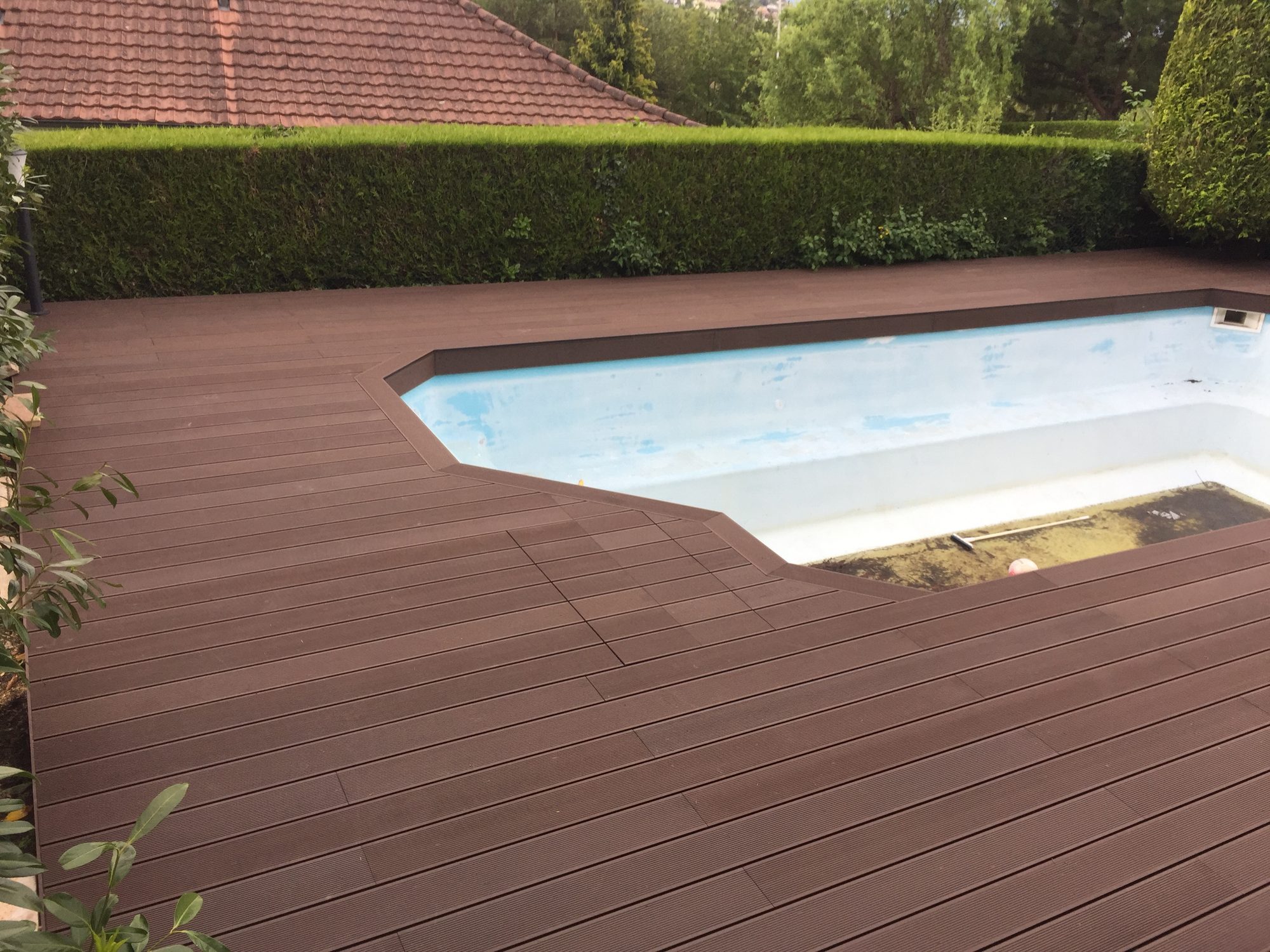 Brown-plank pool deck around the pool