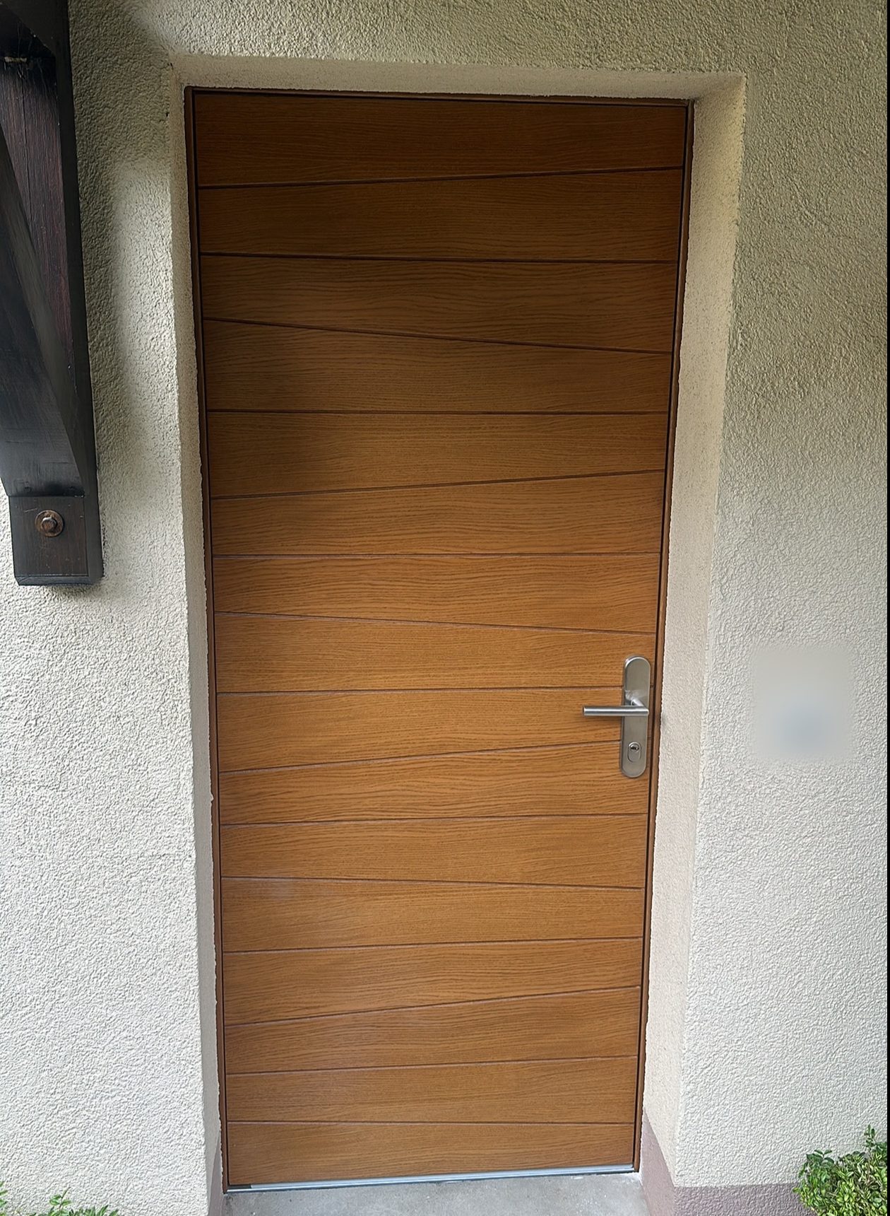 New wooden front door with horizontal lines