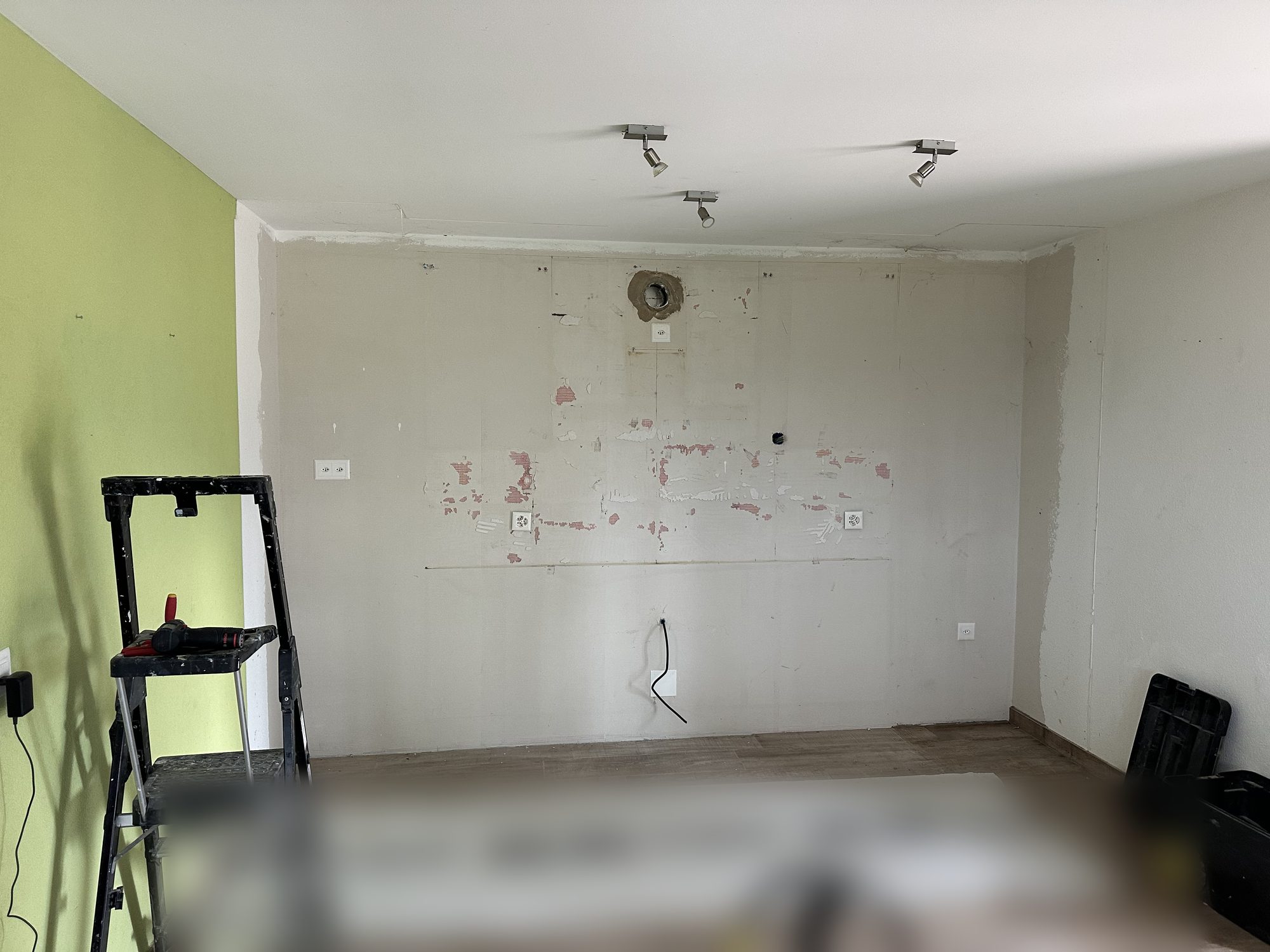 Kitchen removed, bare walls